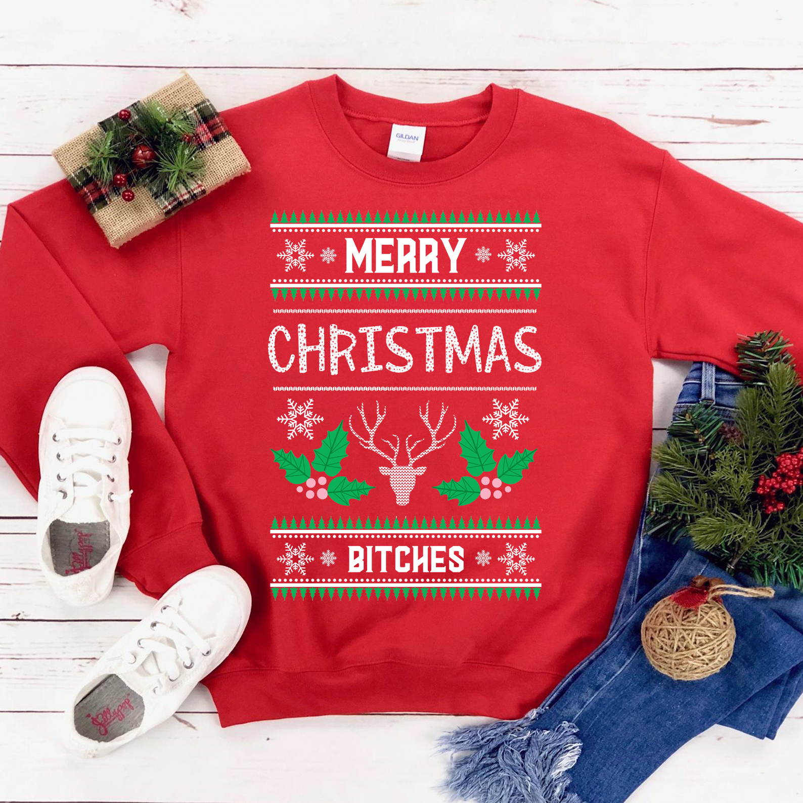 A cozy unisex sweatshirt featuring the phrase 'Merry Christmas Bitches' in festive lettering, perfect for holiday celebrations.