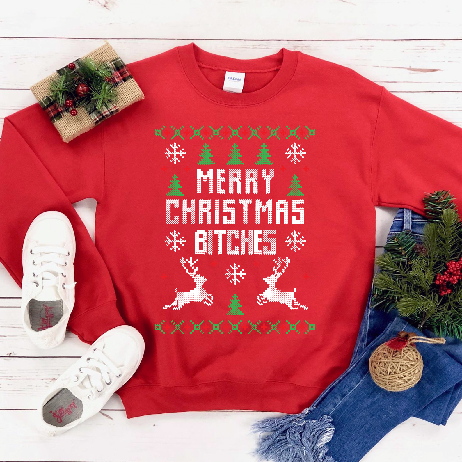 A cozy Merry Christmas Bitches Sweatshirt featuring a humorous holiday design, perfect for festive celebrations.