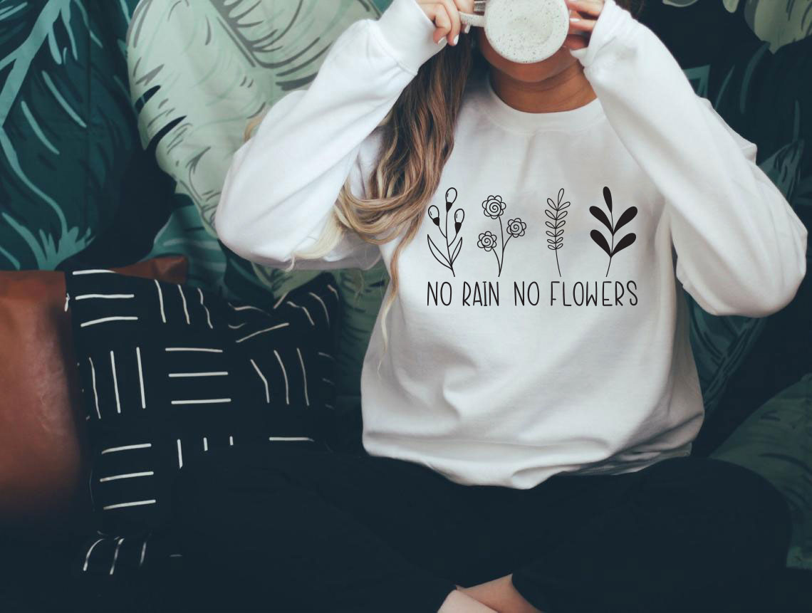 No Rain No Flowers Sweatshirt featuring a classic crewneck design, made from a soft cotton-polyester blend, ideal for casual wear.