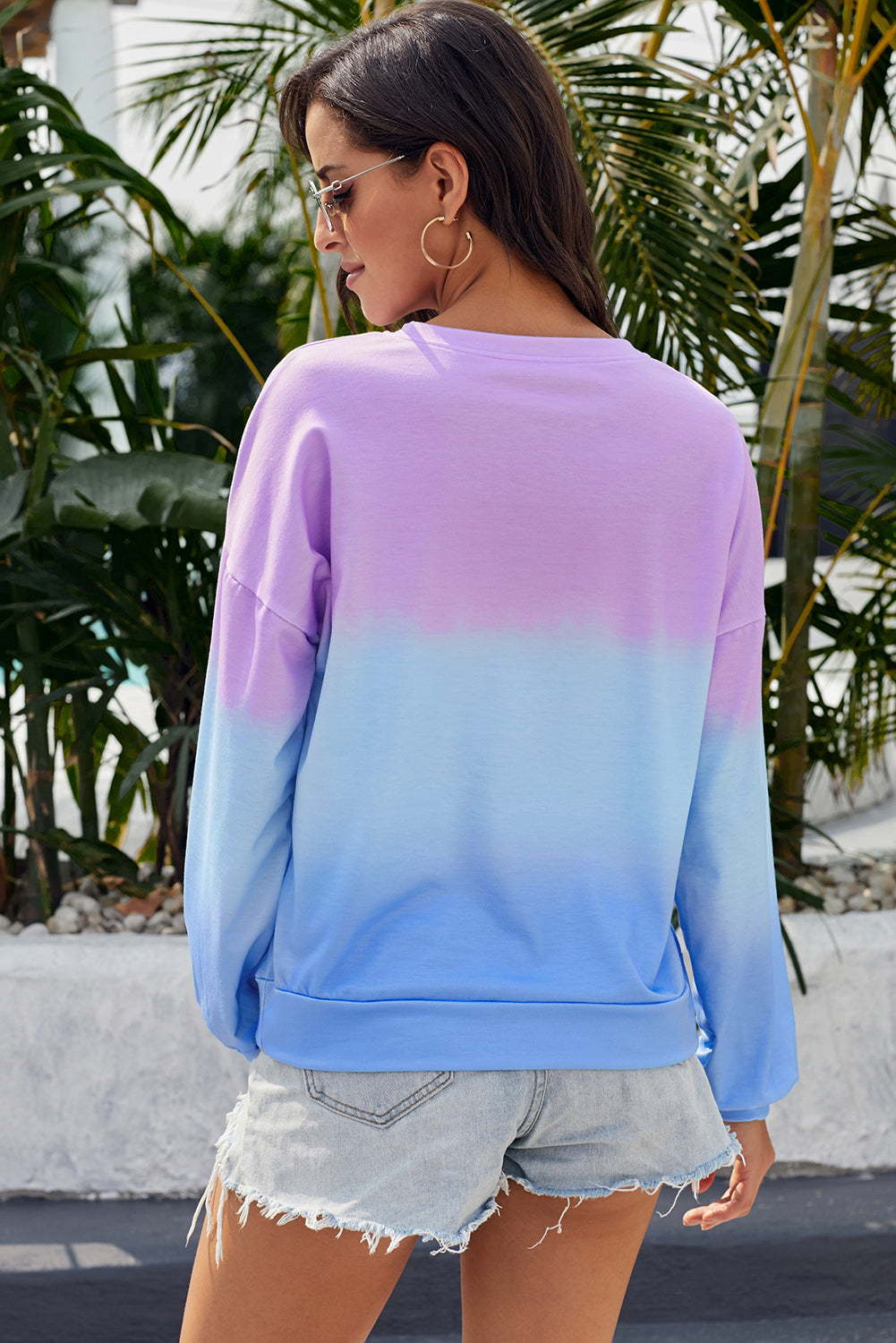 Purple blue color block tie dye pullover sweatshirt with oversized fit and gathered cuffs, perfect for casual wear.