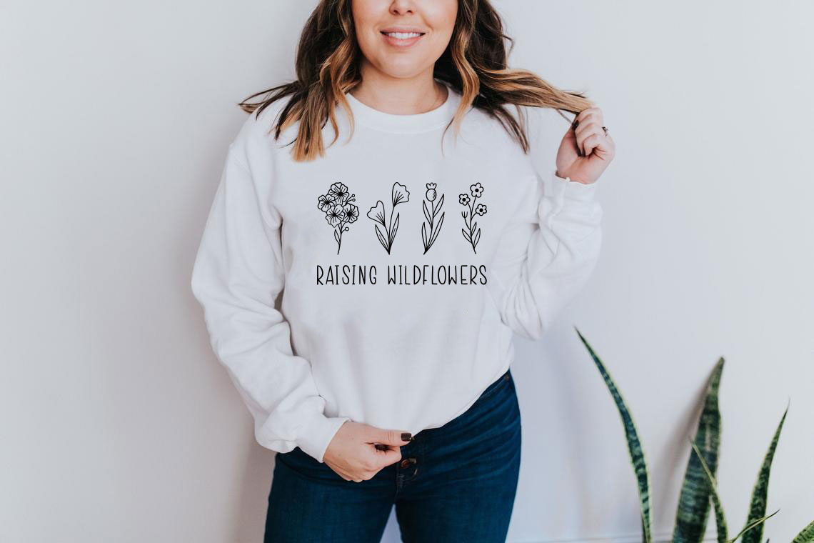 A cozy Raising Wildflowers Sweatshirt featuring a classic fit, made from a soft cotton-polyester blend, perfect for casual wear.