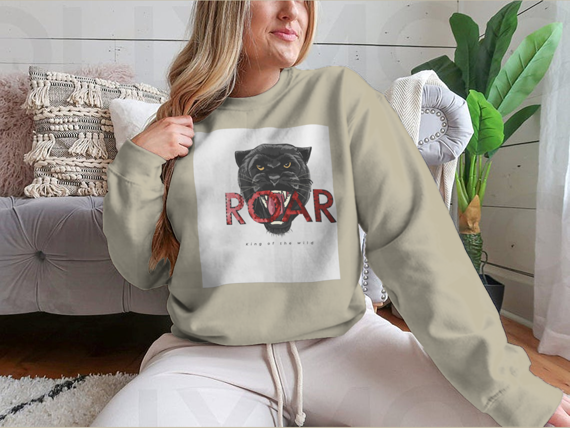 Stylish T-shirt featuring a sequins glitter panther head illustration with the Roar slogan, made from soft cotton fabric.