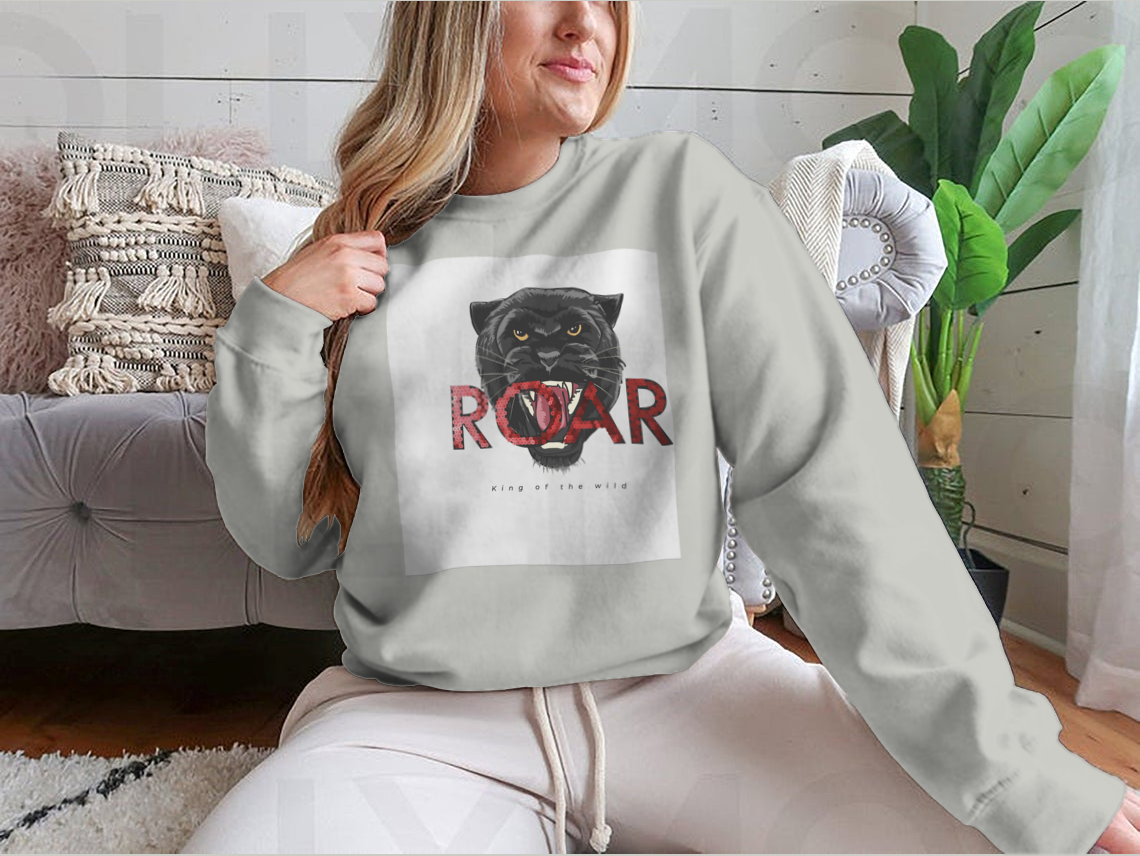 Stylish T-shirt featuring a sequins glitter panther head illustration with the Roar slogan, made from soft cotton fabric.