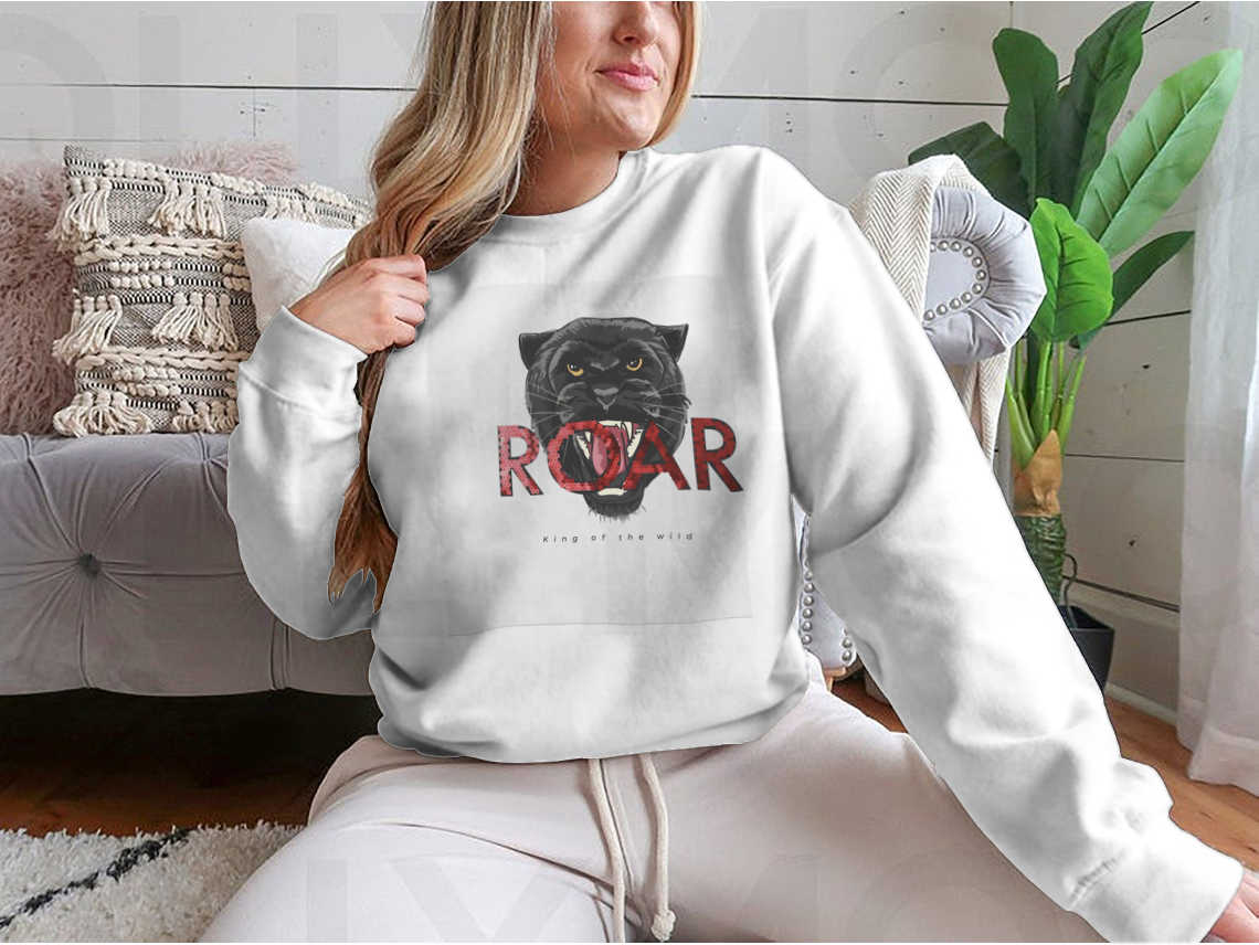 Stylish T-shirt featuring a sequins glitter panther head illustration with the Roar slogan, made from soft cotton fabric.