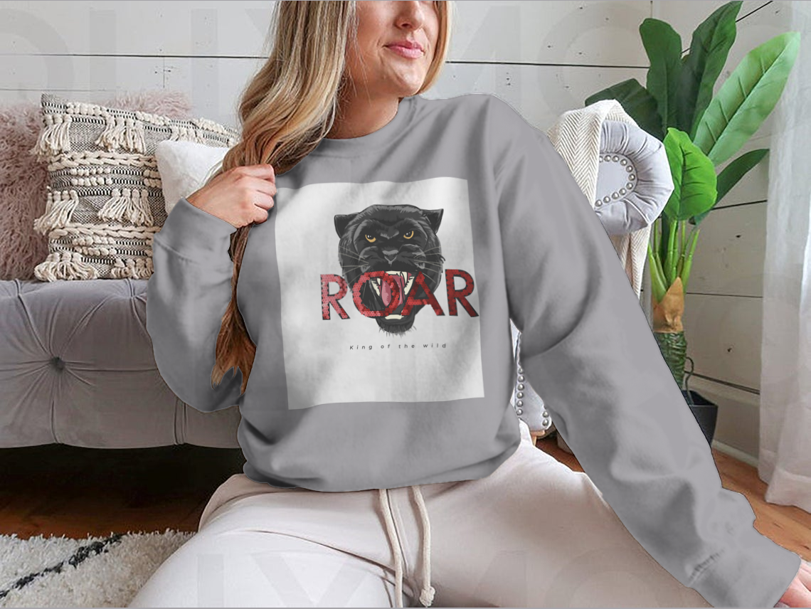 Stylish T-shirt featuring a sequins glitter panther head illustration with the Roar slogan, made from soft cotton fabric.