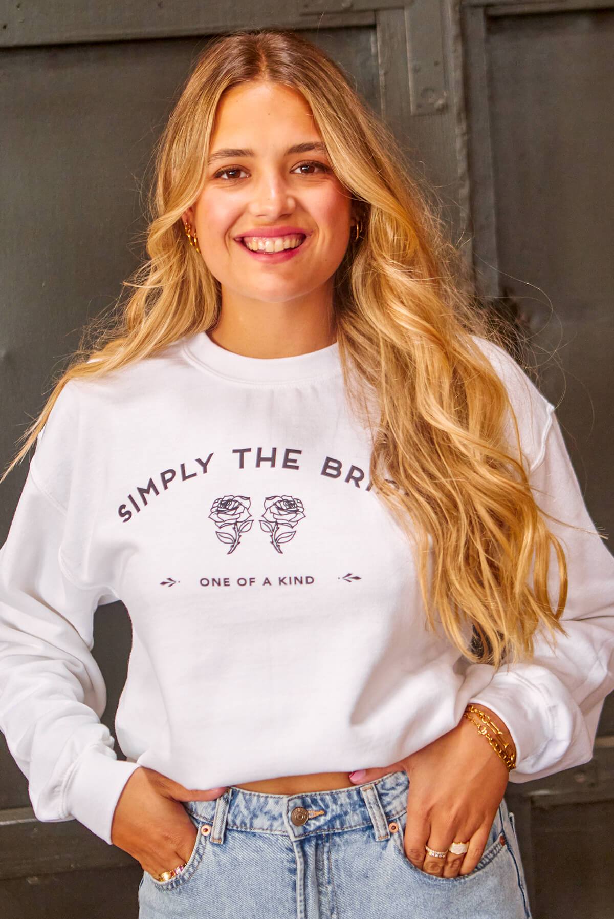 Two stylish bachelorette party sweatshirts in black and white, featuring 'Simply the Bride' and 'Simply the Best' text designs.