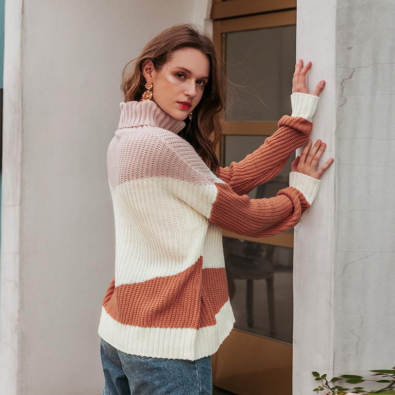 A stylish women's striped turtleneck winter sweater featuring a loose fit and retro design, perfect for casual winter outfits.