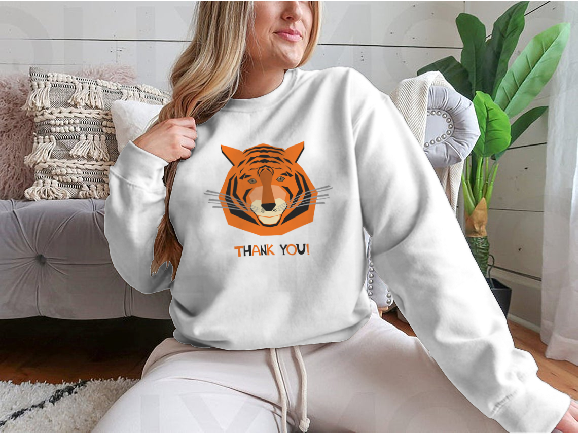 Cute smiling tiger character design on a comfortable tee shirt, perfect for celebrating the Year of the Tiger.