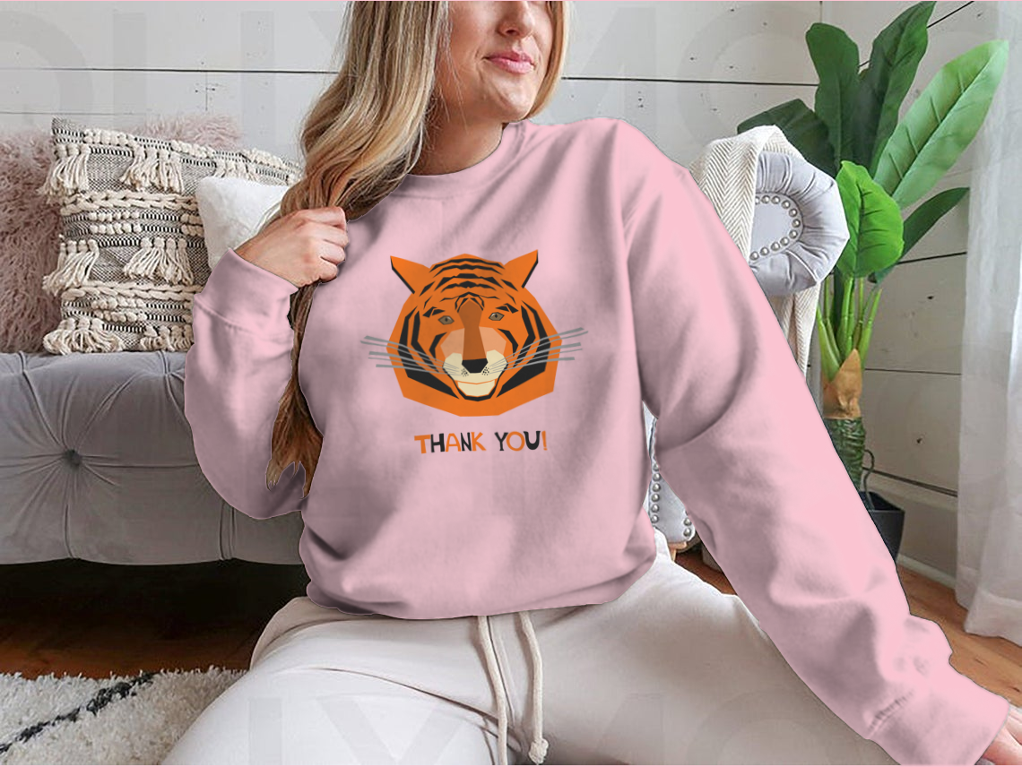 Cute smiling tiger character design on a comfortable tee shirt, perfect for celebrating the Year of the Tiger.