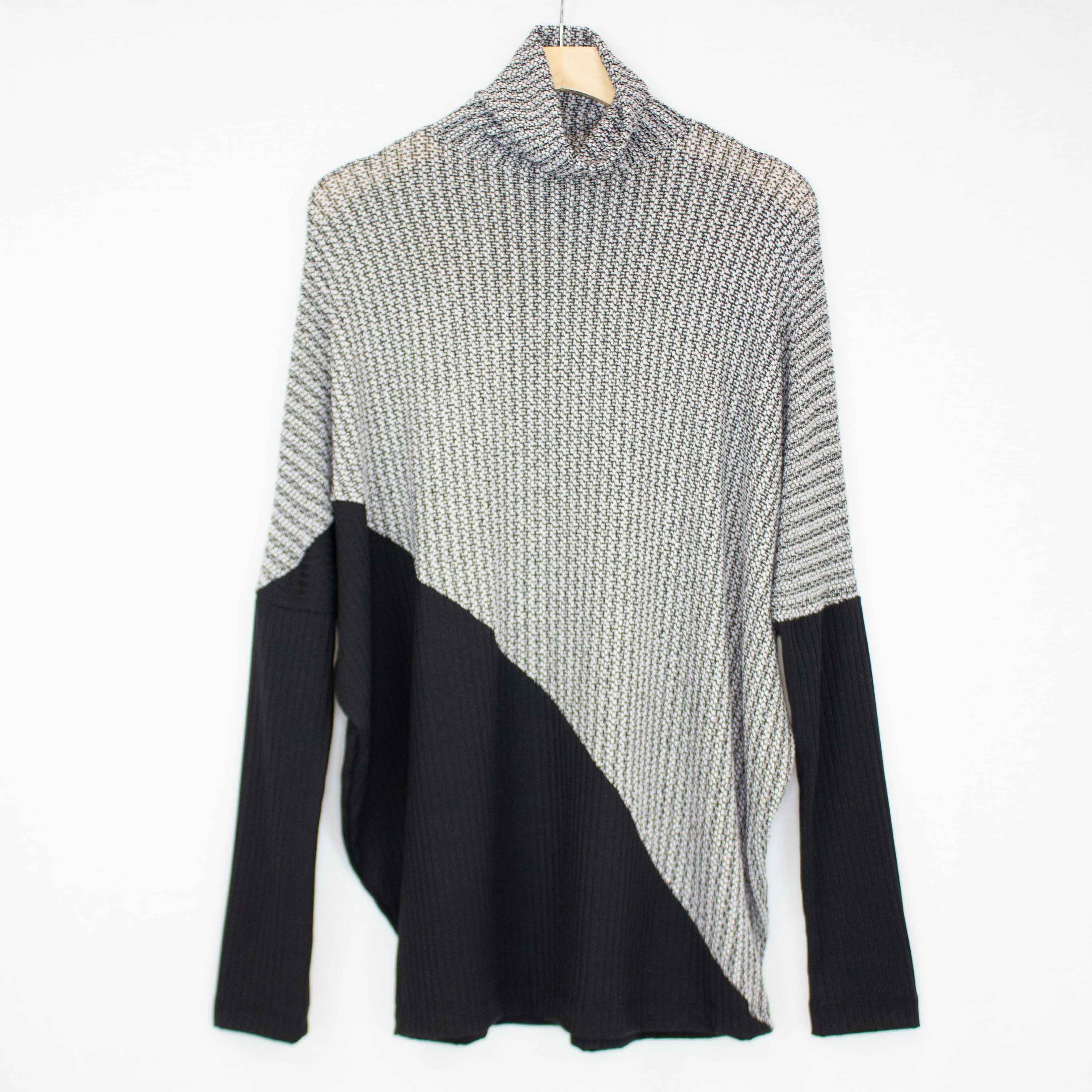 Turtle Neck Diagonal Color Block Top featuring a stylish turtle neck, long sleeves, and a trendy diagonal color block pattern.