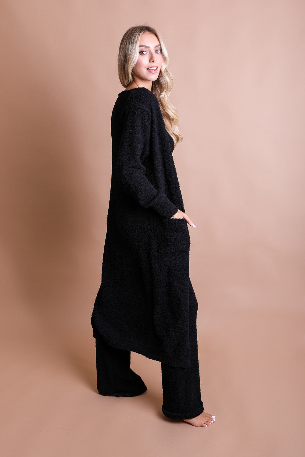 A cozy Ultra-soft Boucle Longline Cardigan in a stylish design, perfect for chilly days and nights.