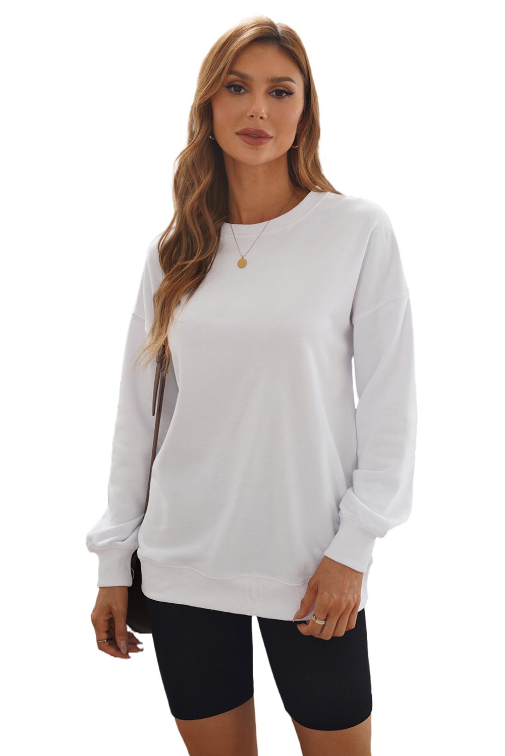 A cozy white oversized sweatshirt with a drop shoulder design, perfect for casual wear in fall and winter.