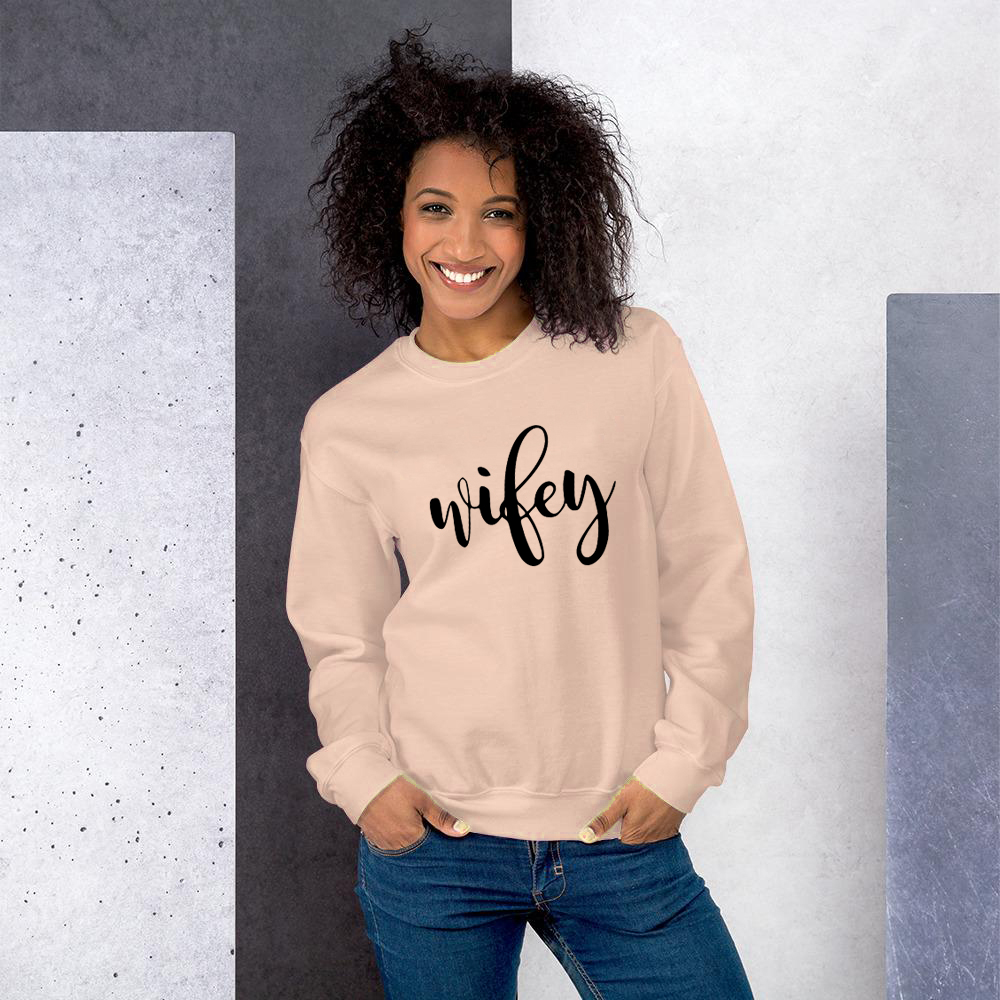 A cozy Wifey Sweatshirt in a classic fit, showcasing its soft fabric and stylish design, perfect for casual wear.