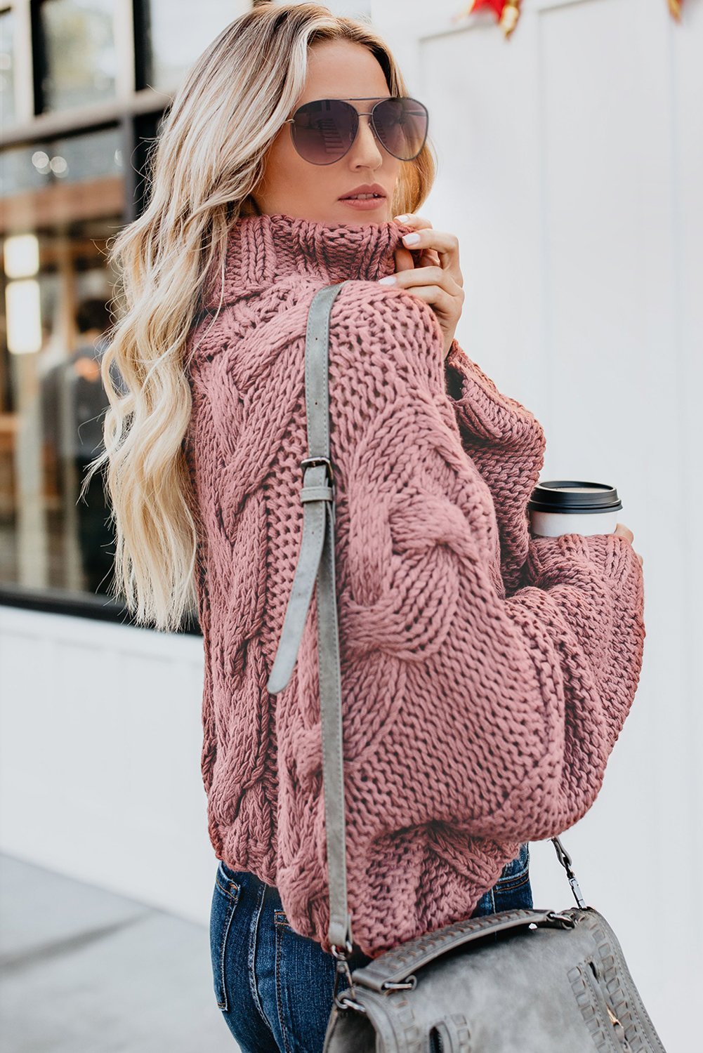 Winter Pink Cuddle Weather Cable Knit Handmade Turtleneck Sweater featuring a chunky design and elegant turtleneck, perfect for winter styling.