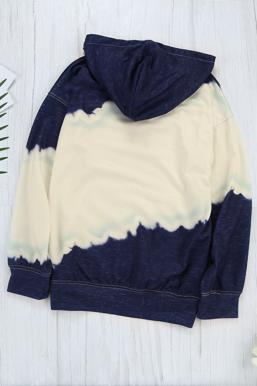 Women wearing a navy tie dye print casual hooded sweatshirt with pockets, showcasing a stylish and comfortable design.