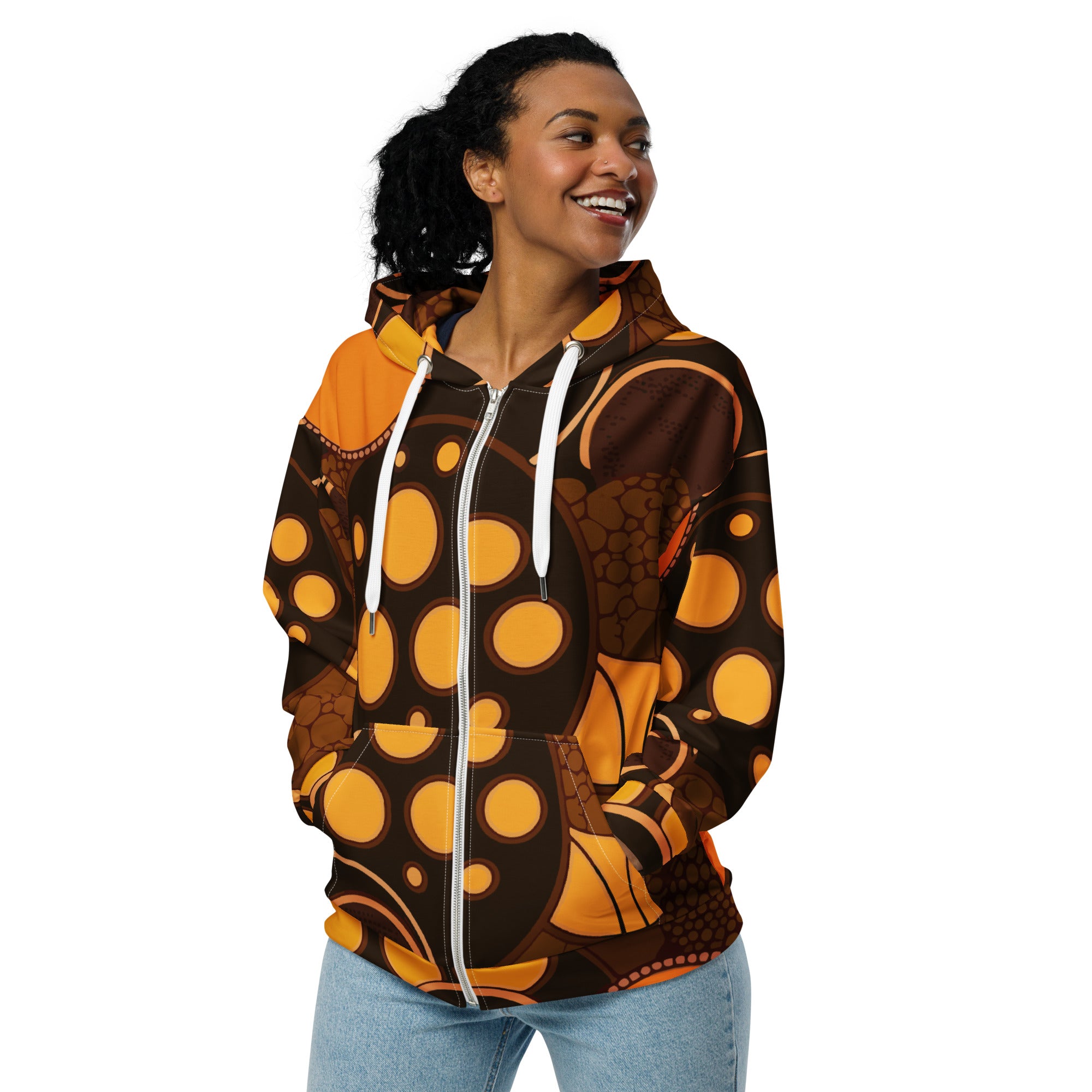 Women's Graphic Zip Hoodie featuring an orange and brown spotted print, showcasing a relaxed fit and double-lined hood.