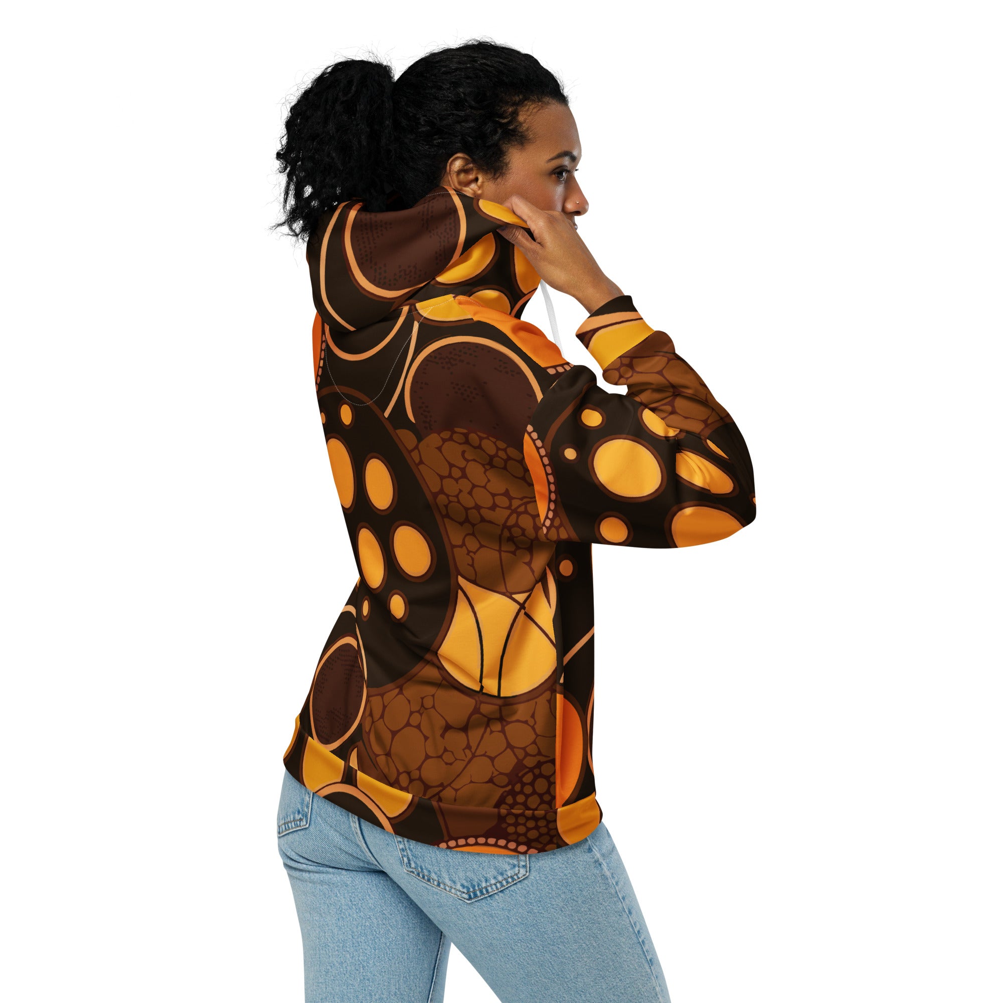 Women's Graphic Zip Hoodie featuring an orange and brown spotted print, showcasing a relaxed fit and double-lined hood.