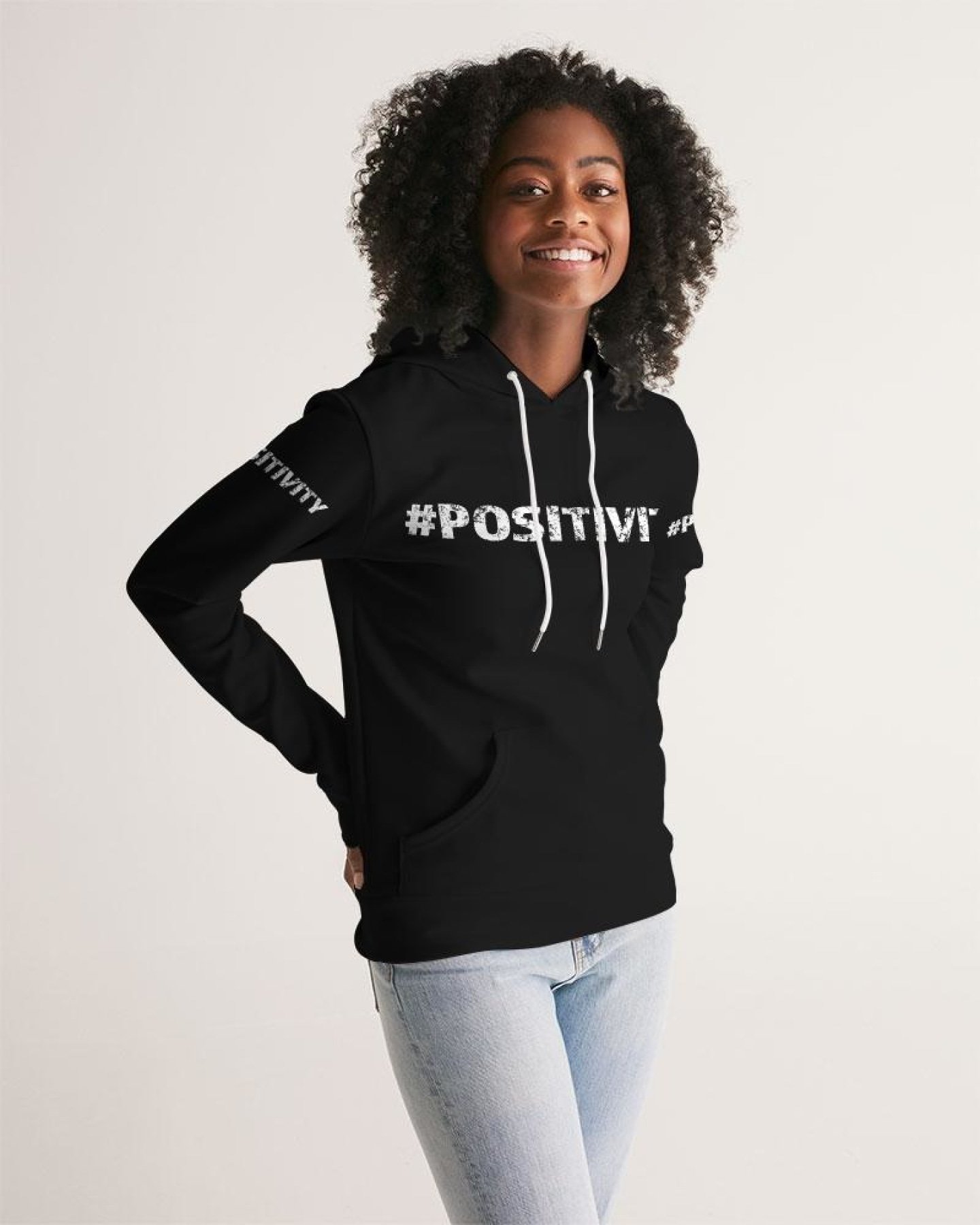 A stylish women's pullover hoodie featuring a graphic design promoting positivity, made from premium fabric with a drawstring hood and front pocket.