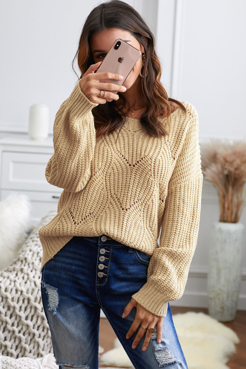 Women's khaki hollow-out knitted sweater featuring a round neck and long sleeves, showcasing a unique texture and elegant design.