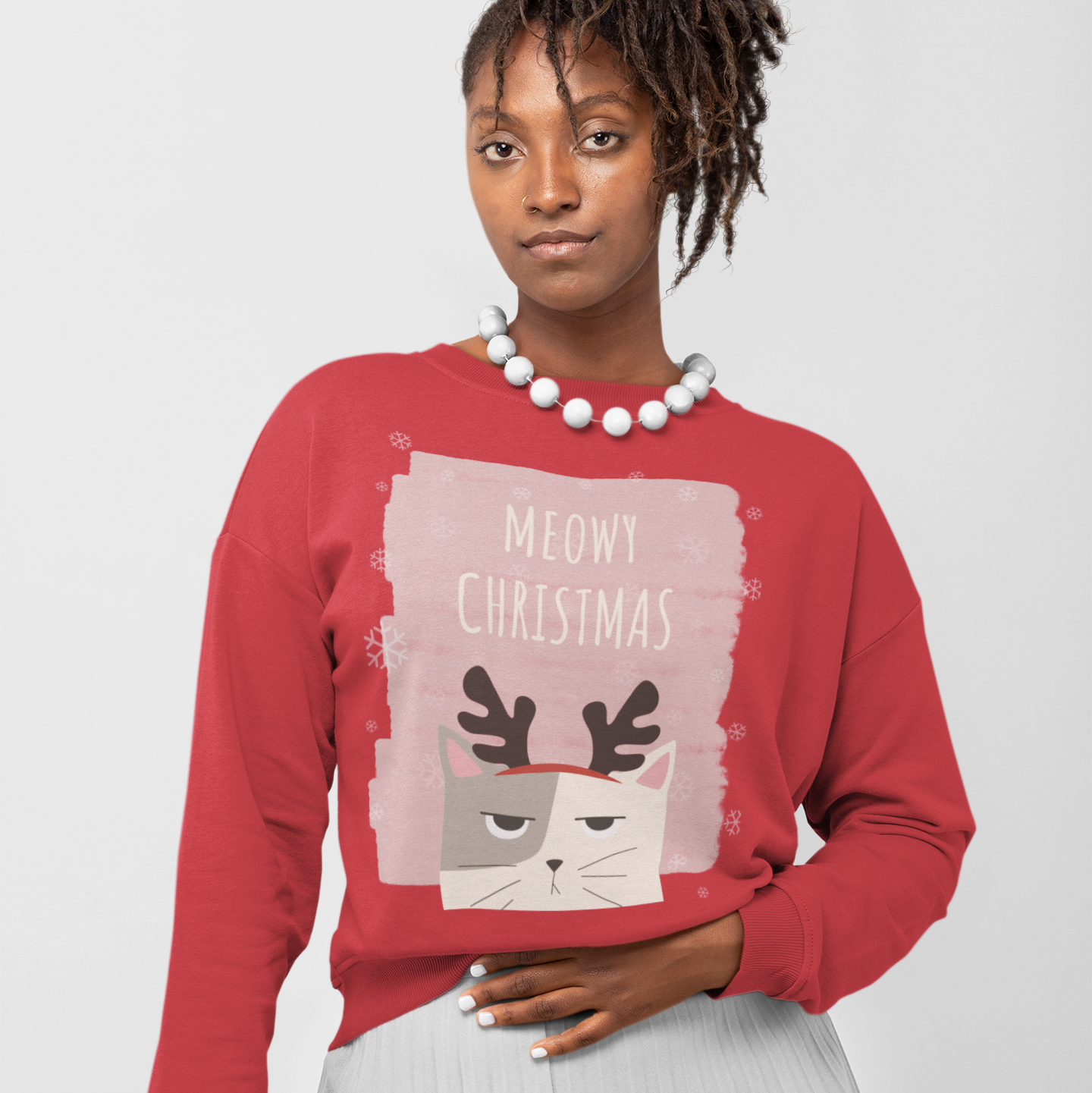 Womens Meowy Christmas Sweatshirt featuring a festive design with a loose fit and ribbed knit collar, perfect for holiday celebrations.