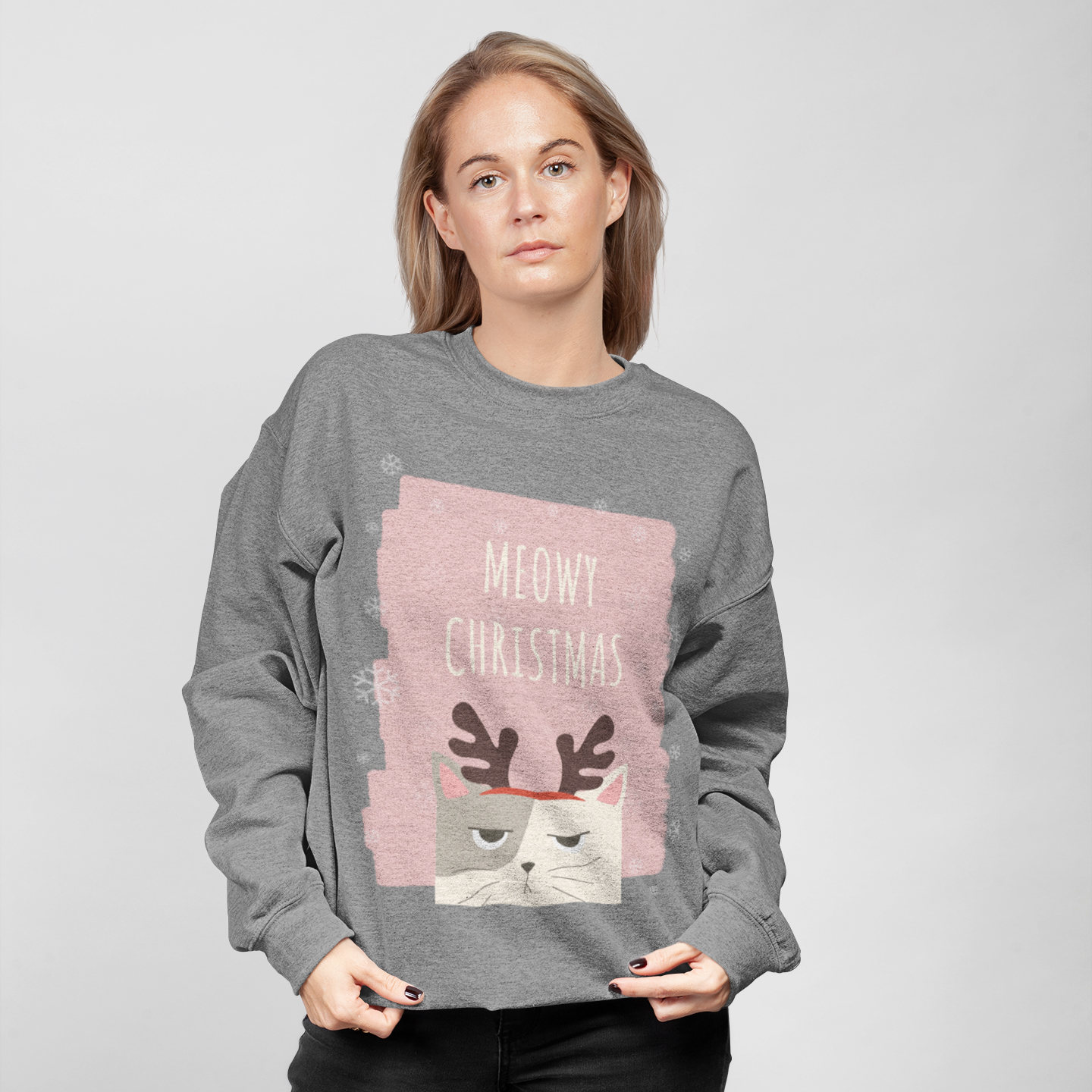 Womens Meowy Christmas Sweatshirt featuring a festive design with a loose fit and ribbed knit collar, perfect for holiday celebrations.