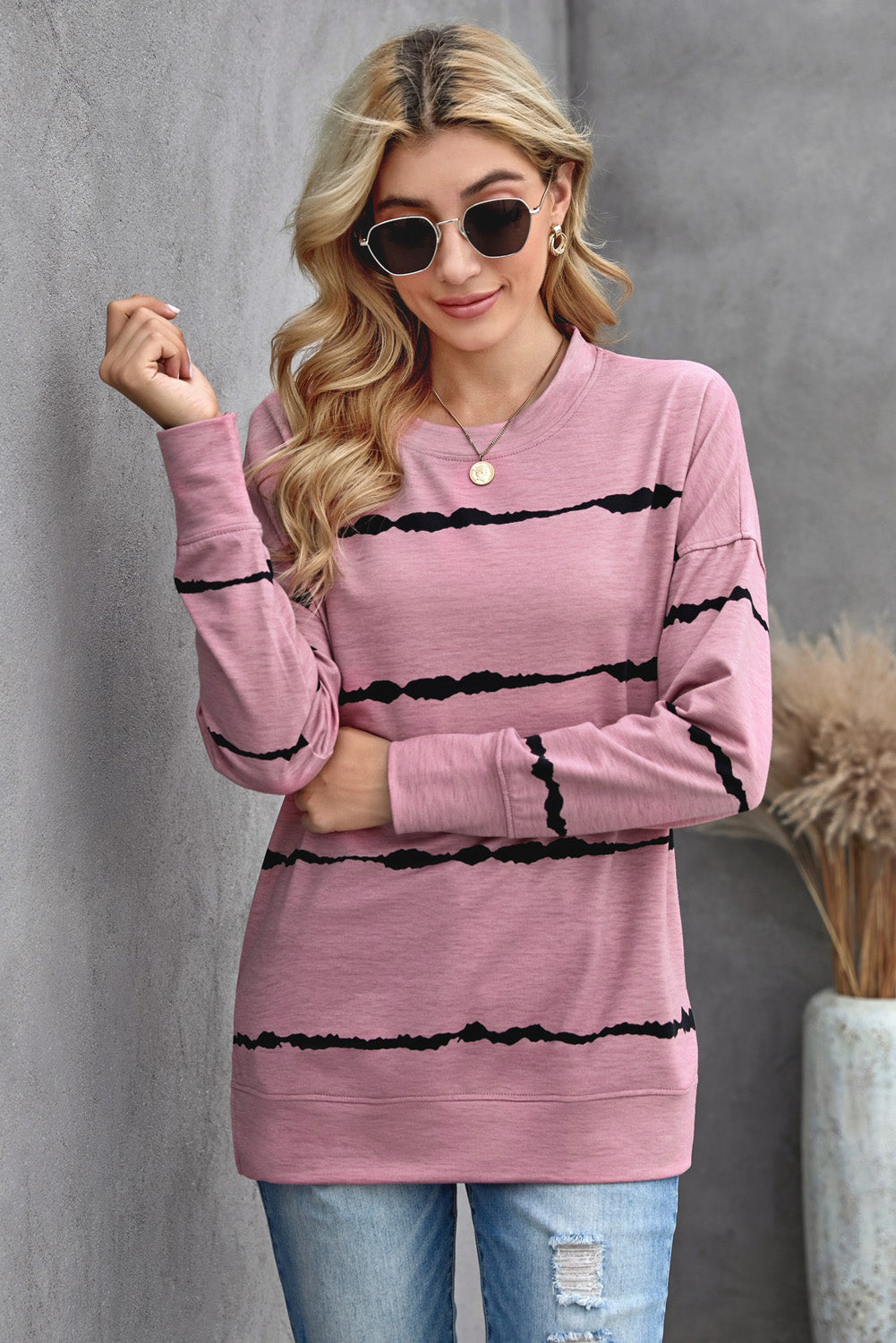 Womens Tie-dye Stripes Pink Sweatshirt featuring a vibrant pink color with stylish striped patterns, perfect for casual wear.