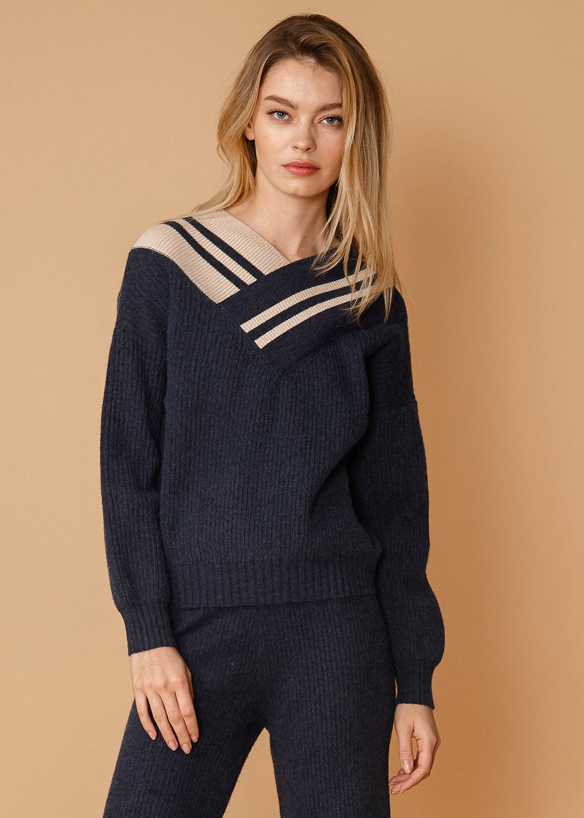 Women's Varsity Sweater in Midnight featuring a V-neck design and thick material, perfect for casual wear.