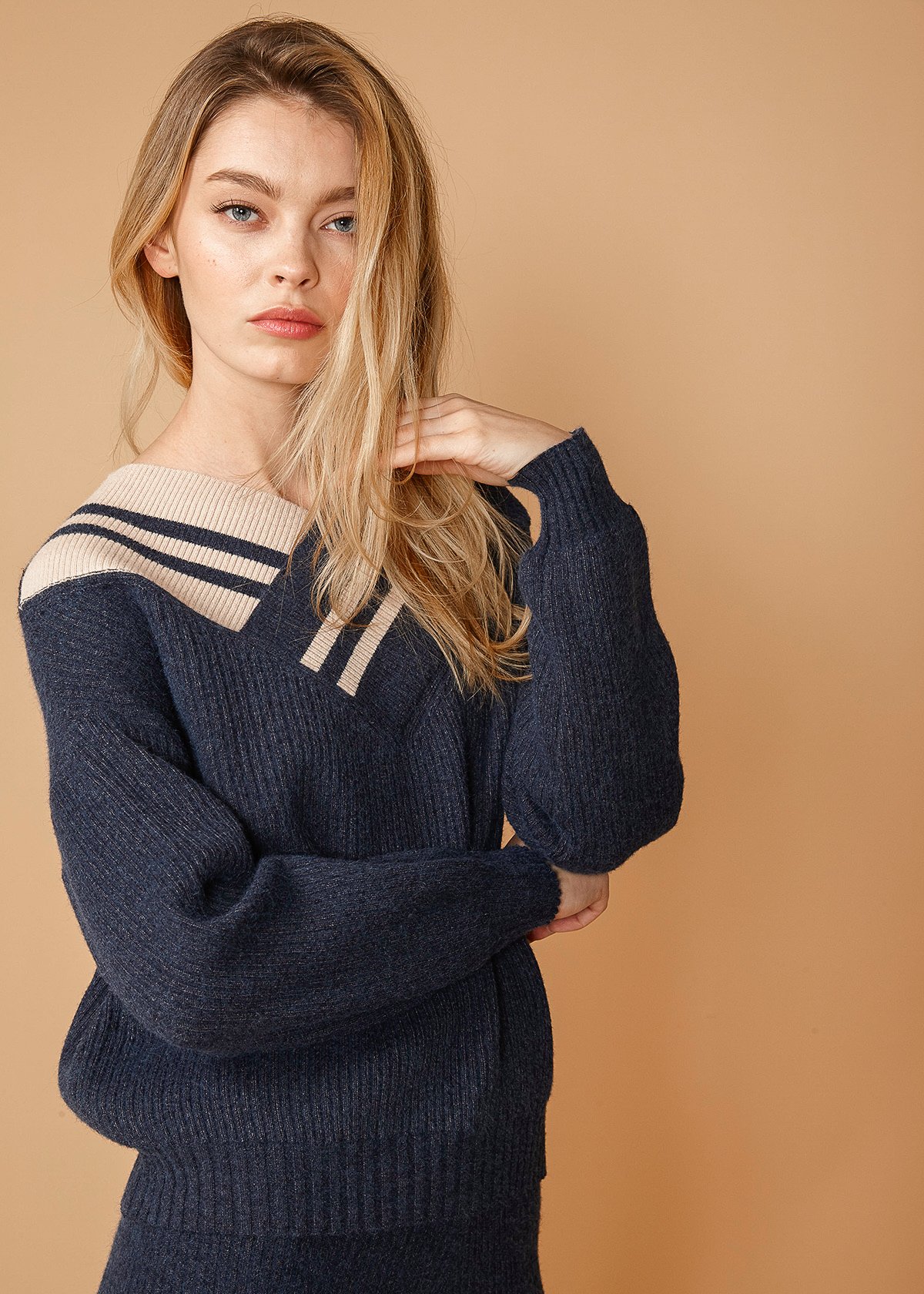 Women's Varsity Sweater in Midnight featuring a V-neck design and thick material, perfect for casual wear.