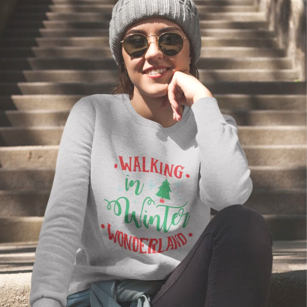 Womens Winter Wonderland Sweatshirt in white, featuring a loose fit and ribbed collar, perfect for holiday festivities.