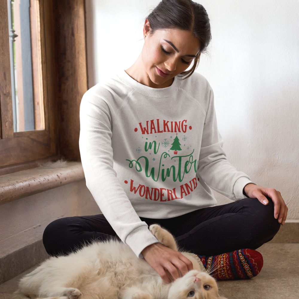 Womens Winter Wonderland Sweatshirt in white, featuring a loose fit and ribbed collar, perfect for holiday festivities.