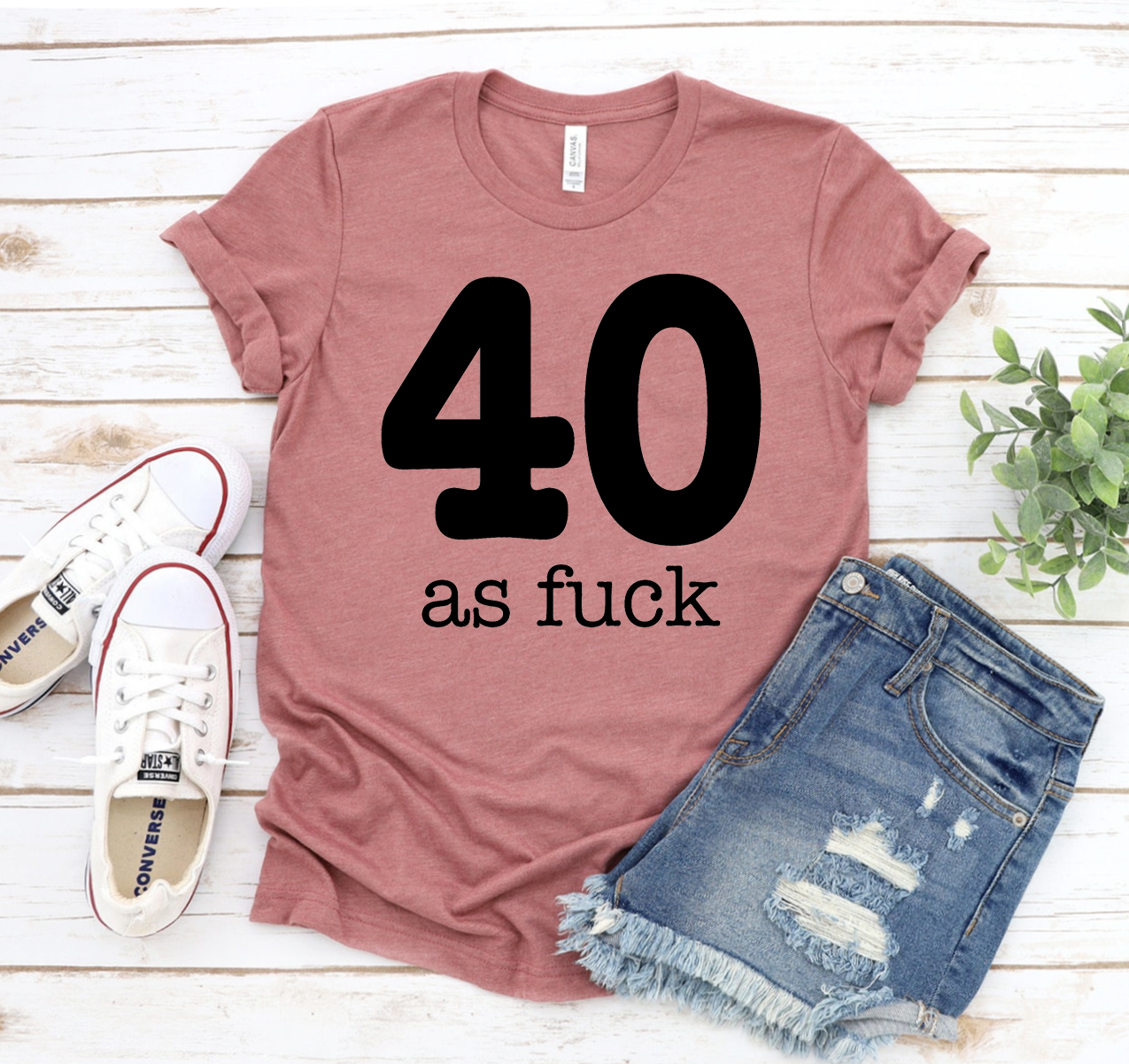 A stylish unisex 40 As Fuck T-shirt made from soft airlume cotton, featuring a bold graphic design.