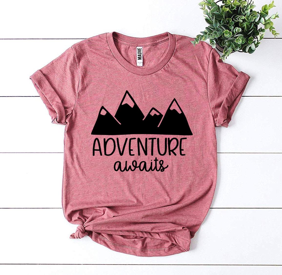 Adventure Awaits T-shirt made of premium ring spun cotton with a vibrant flex print design, available in various sizes.