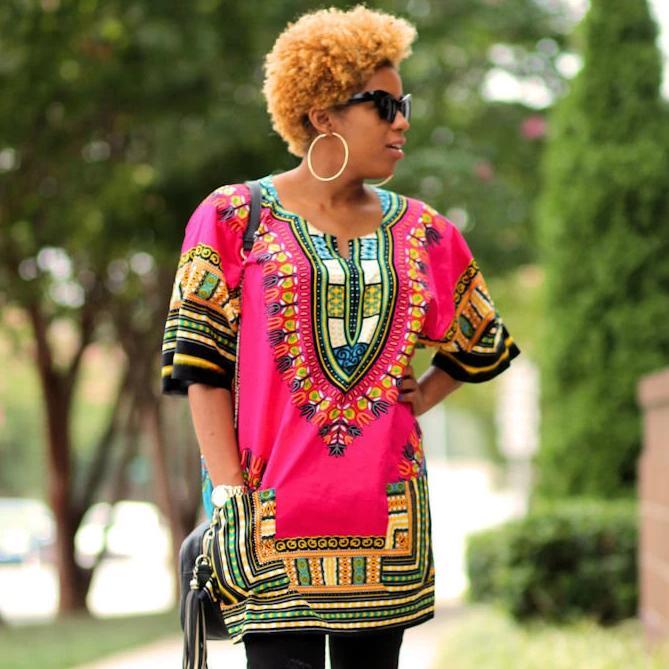 A vibrant pink African Dashiki Print Women Shirt made from 100% cotton, showcasing intricate patterns and a stylish design.