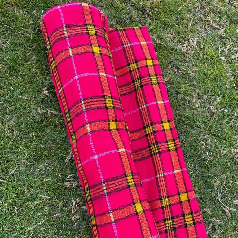 Vibrant African Maasai Shuka blanket showcasing colorful prints and elegant design, perfect for various uses.