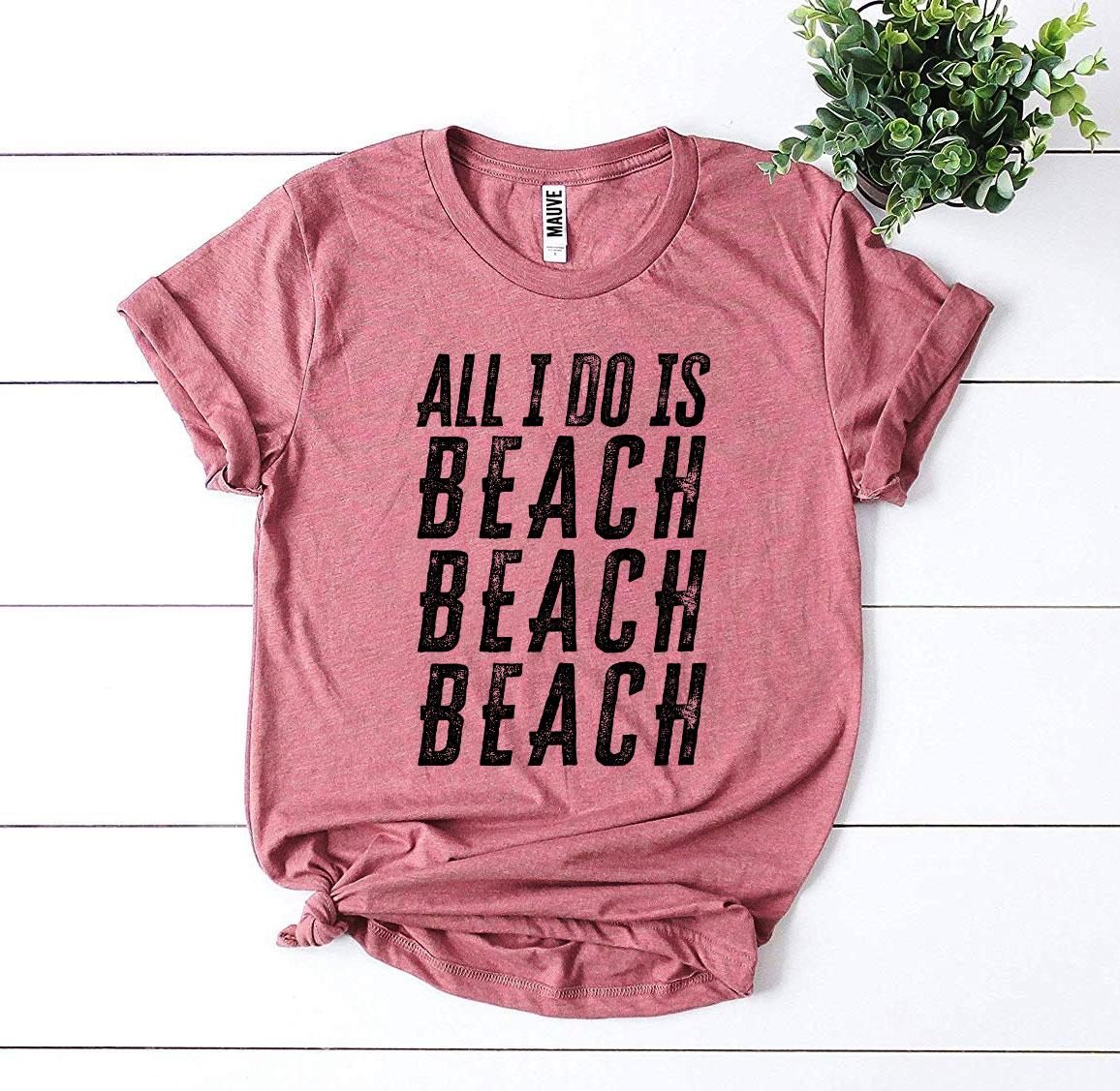 All I Do Is Beach Beach Beach T-shirt in various sizes, showcasing its soft cotton fabric and vibrant print design.