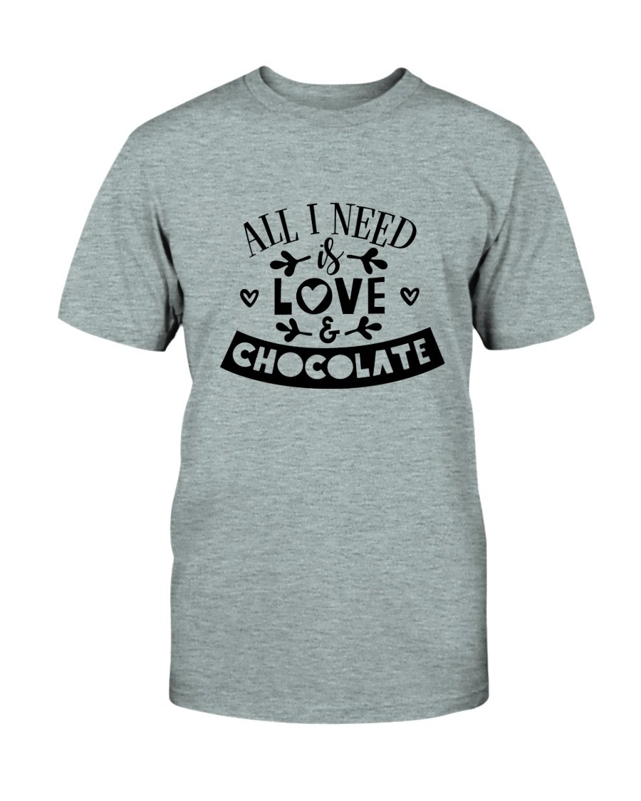 Unisex T-shirt featuring the phrase 'All I Need Is Love & Chocolate' in vibrant print, made from soft ring spun cotton.