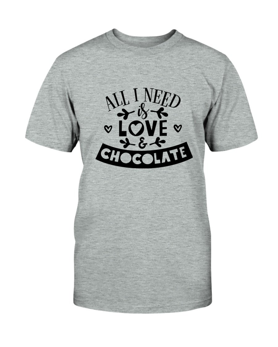 Unisex T-shirt featuring the phrase 'All I Need Is Love & Chocolate' in vibrant print, made from soft ring spun cotton.