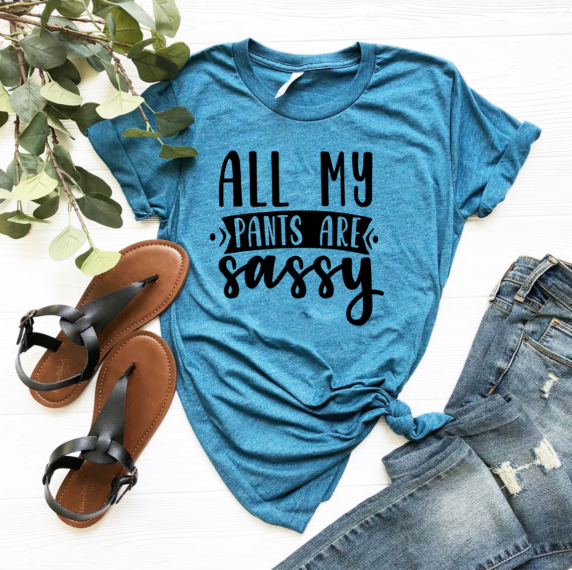 Unisex All My Pants Are Sassy Shirt in various colors, showcasing its soft fabric and stylish design.