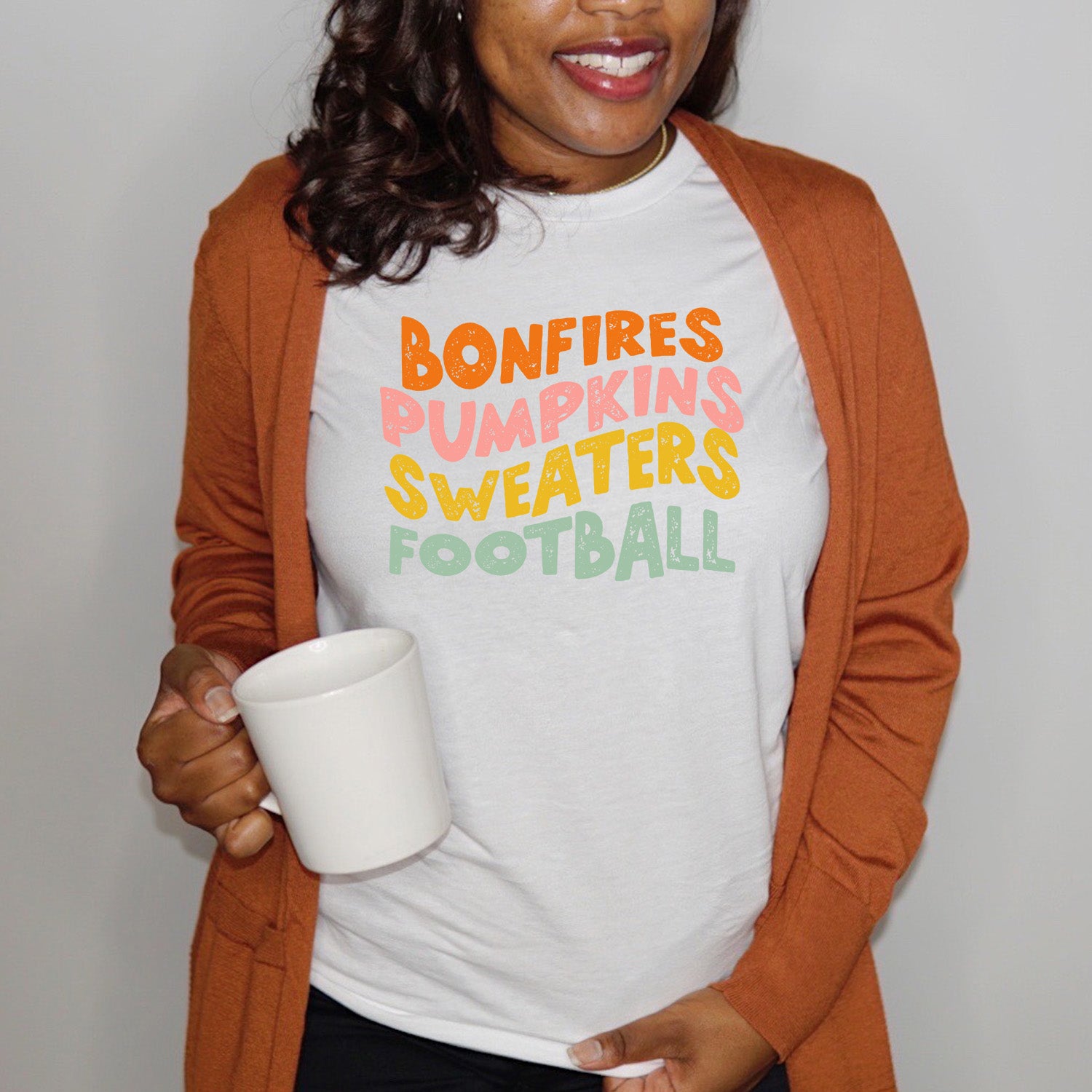 All the Fall Things Unisex T-shirt featuring vibrant autumn-themed design, perfect for cozy fall days.