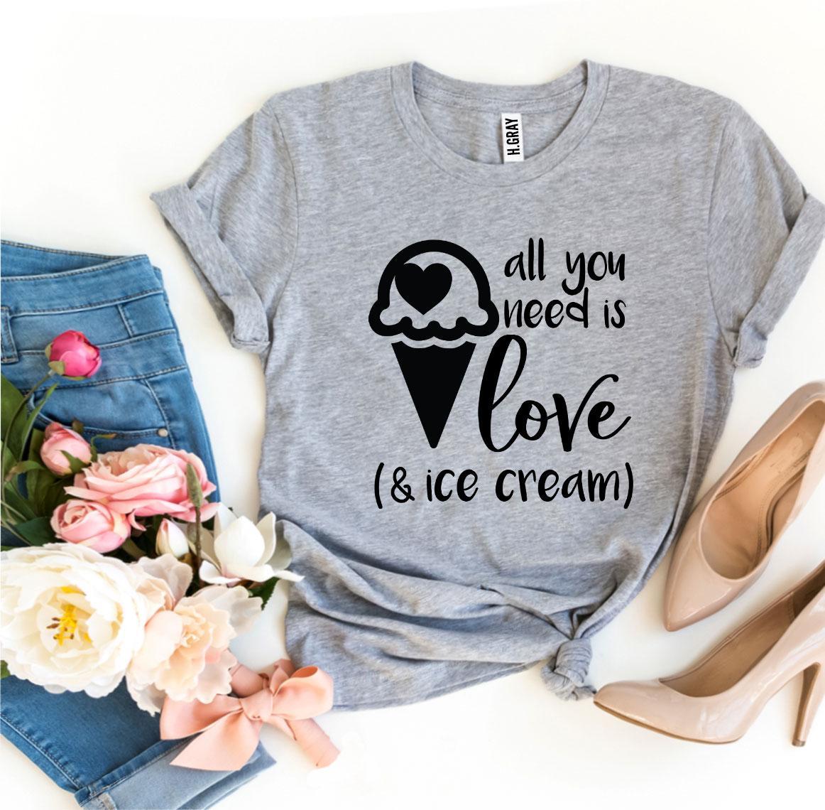 A stylish t-shirt featuring the phrase 'All You Need Is Love And Ice Cream' printed in vibrant colors on a soft fabric.