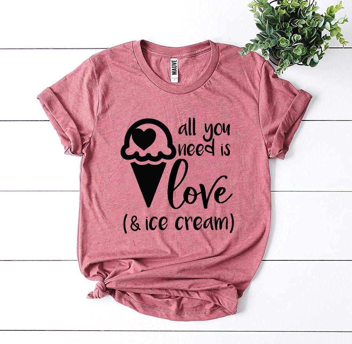 A stylish t-shirt featuring the phrase 'All You Need Is Love And Ice Cream' printed in vibrant colors on a soft fabric.