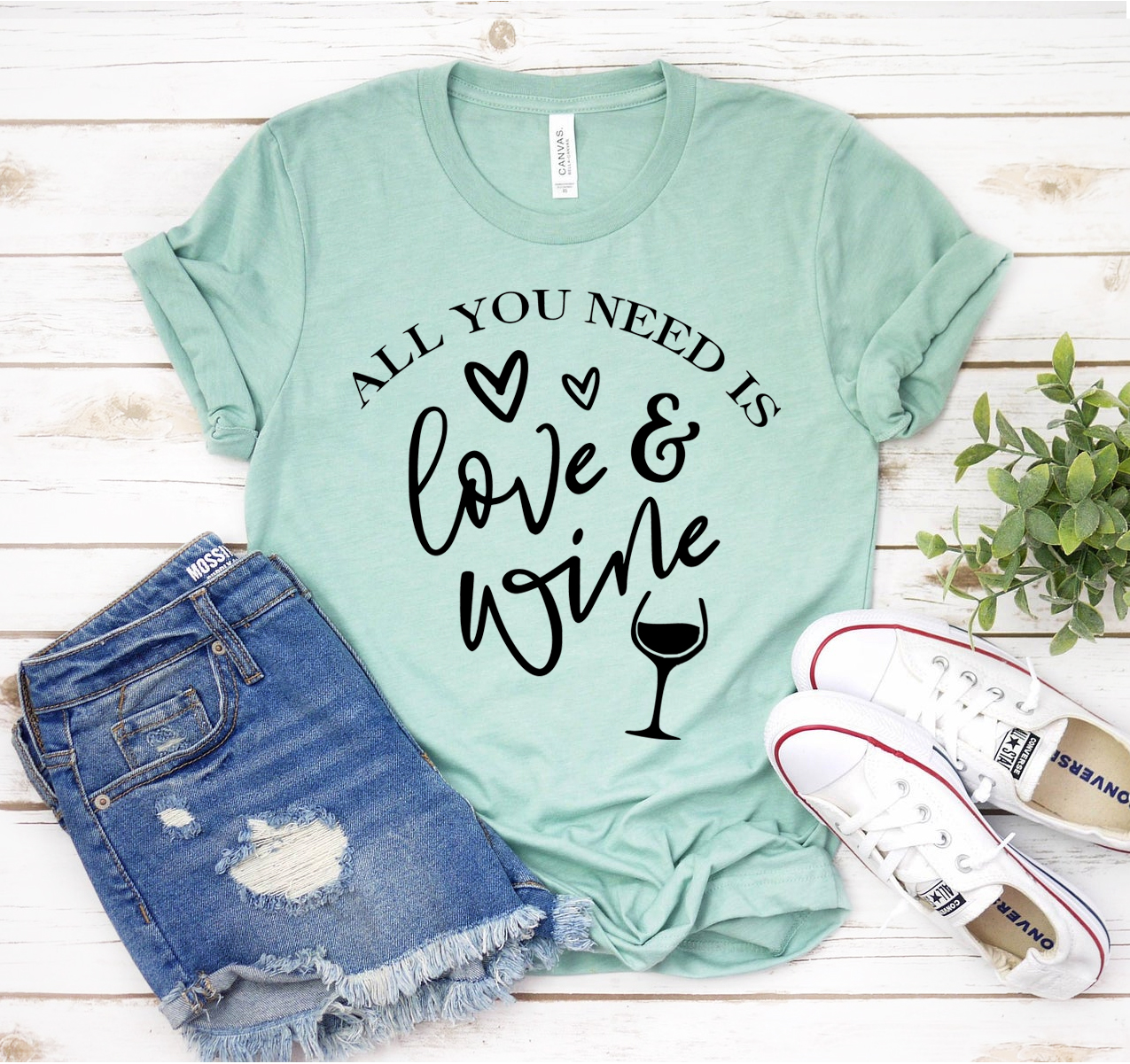 Unisex Bella Canvas T-shirt featuring the phrase 'All You Need Is Love And Wine' in a stylish design.