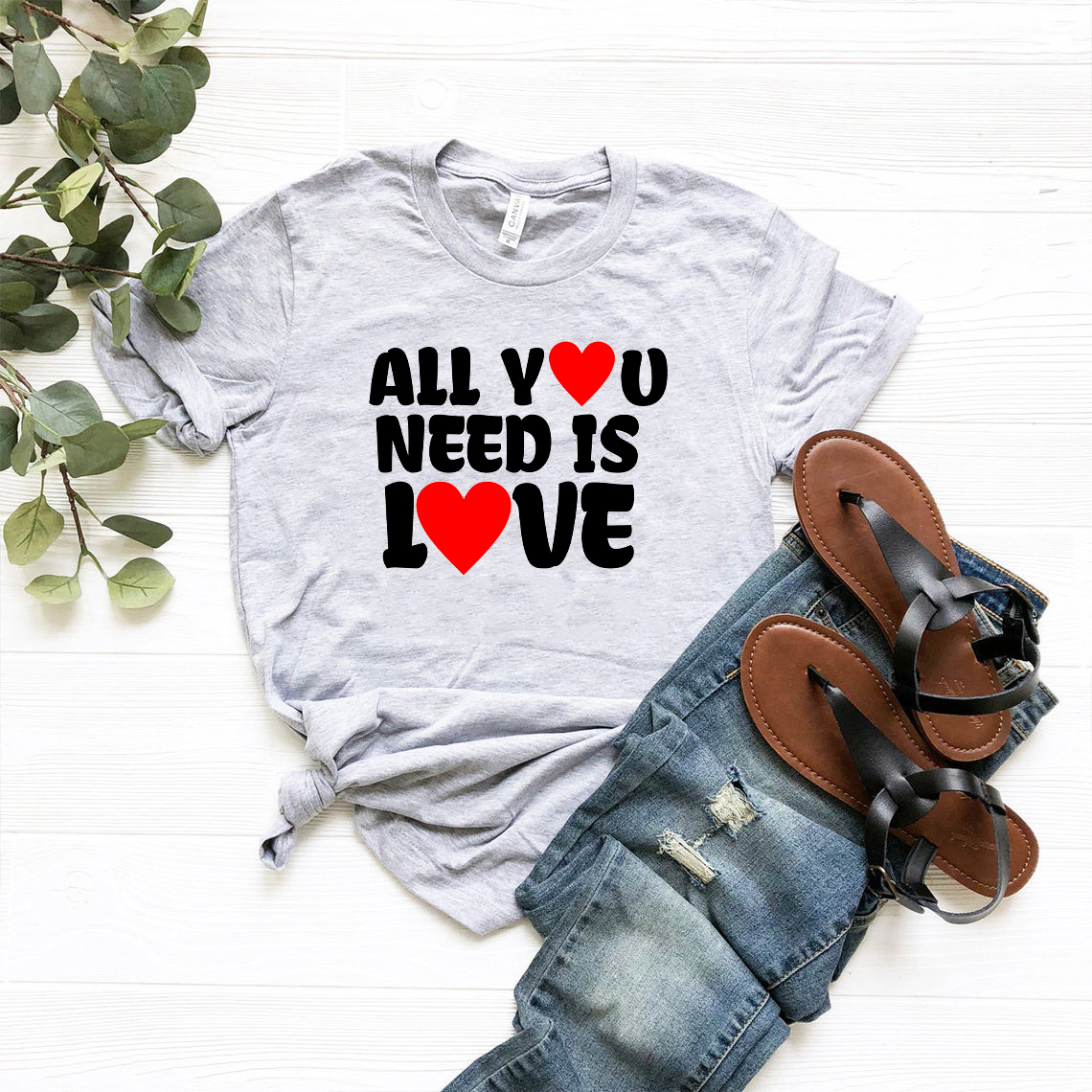 Unisex All You Need Is Love Shirt in various colors, showcasing its comfortable fit and high-quality print.