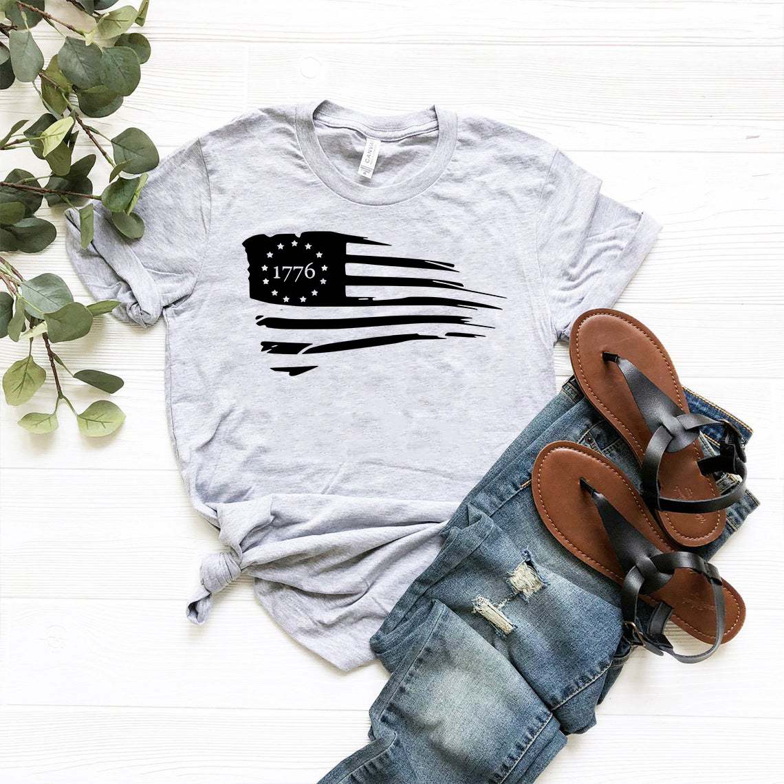 A comfortable unisex American Flag Shirt made from soft ring spun cotton, featuring a vibrant print of the American flag.