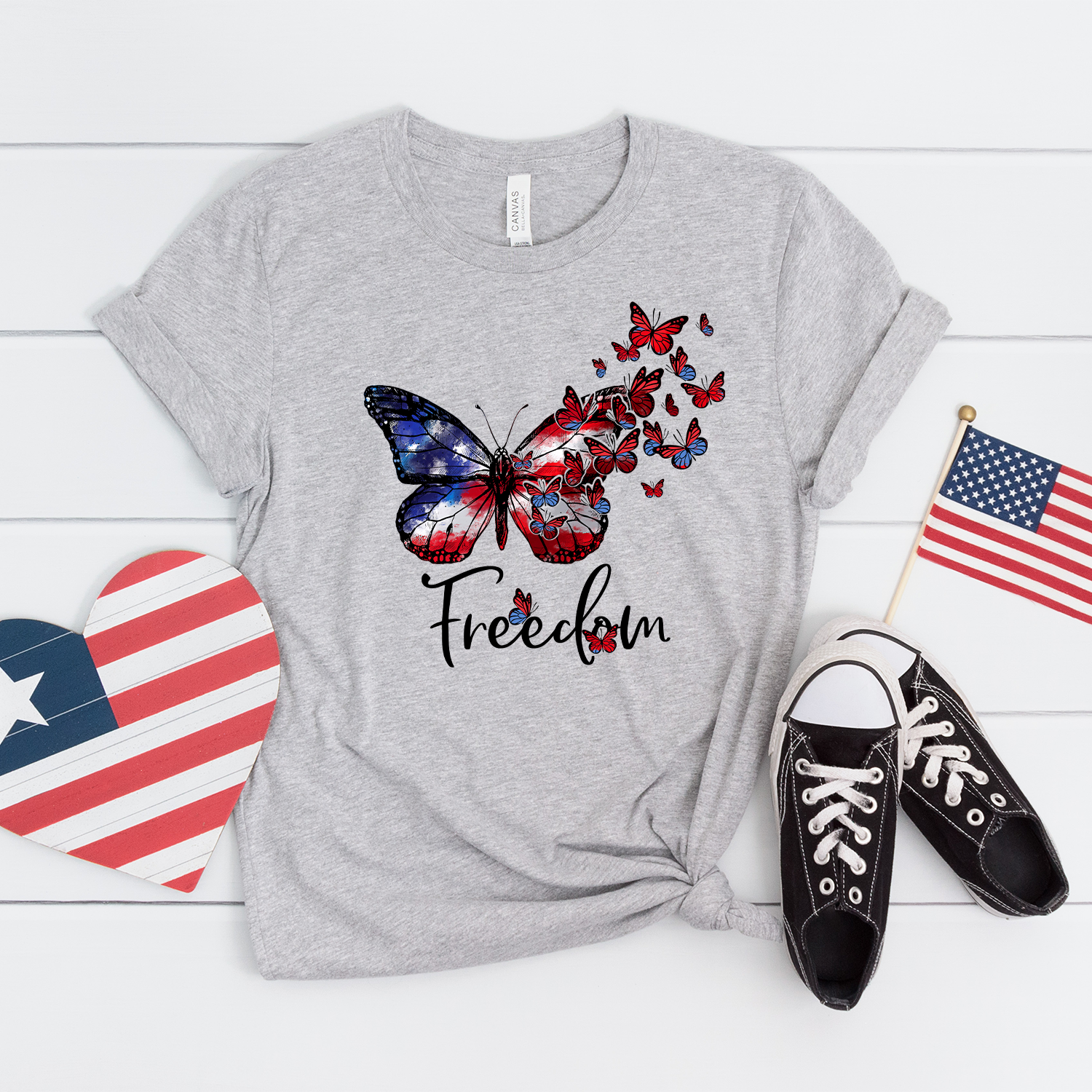 American Freedom Butterfly Unisex T-shirt featuring a vibrant butterfly graphic on a soft fabric.