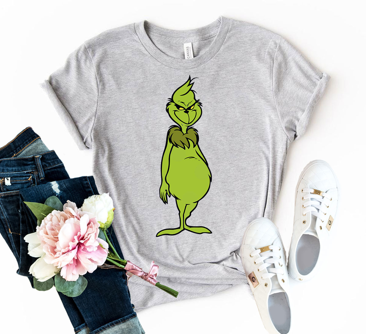 A vibrant Angry Grinch Shirt made from soft ring spun cotton, featuring a classic crew neck and short sleeves, available in multiple colors.