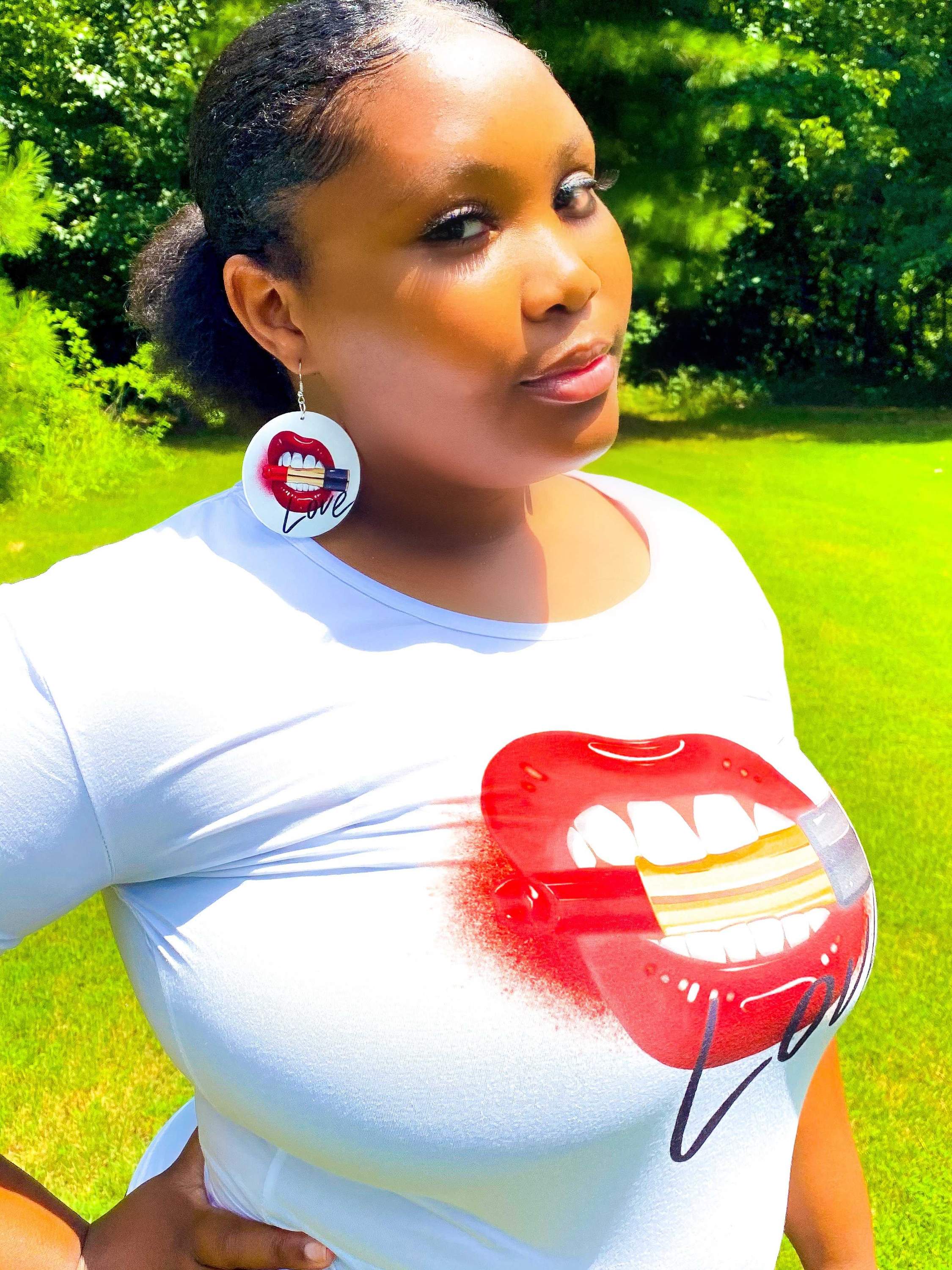 Love, Muahhhh Hoops T-Shirt in white cotton with vibrant front print, showcasing a fun and casual style.