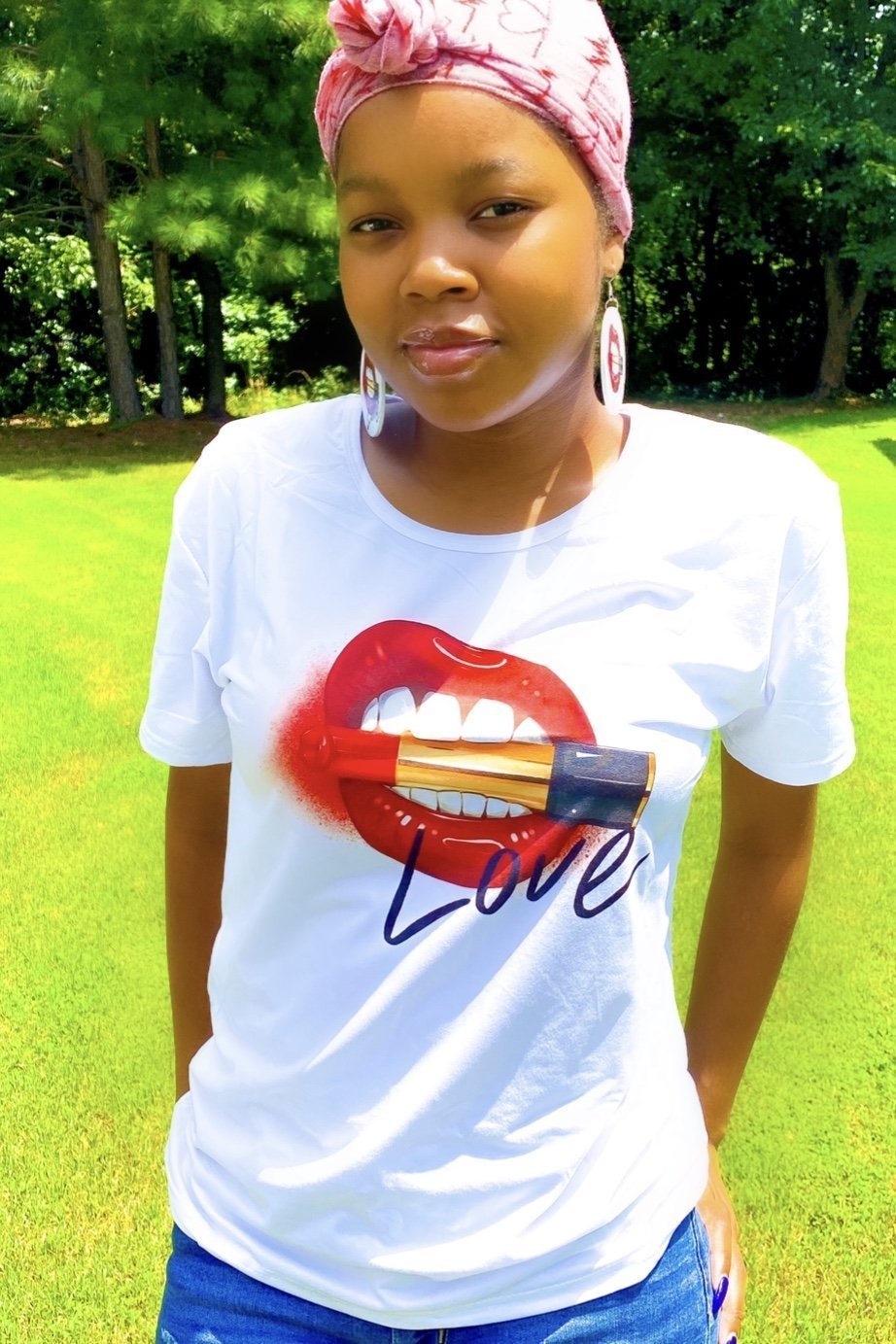 Love, Muahhhh Hoops T-Shirt in white cotton with vibrant front print, showcasing a fun and casual style.