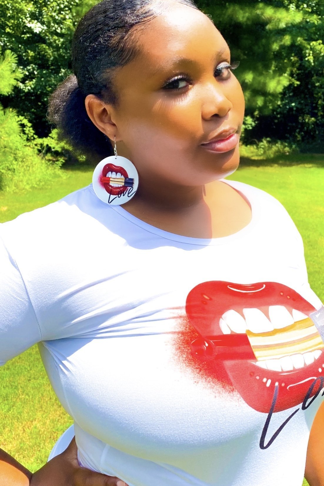 Love, Muahhhh Hoops T-Shirt in white cotton with vibrant front print, showcasing a fun and casual style.