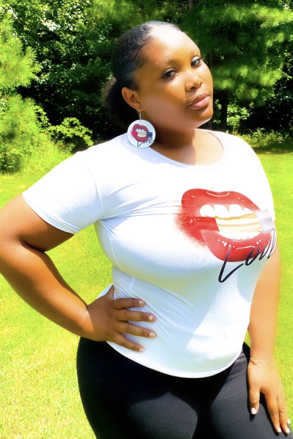 Love, Muahhhh Hoops T-Shirt in white cotton with vibrant front print, showcasing a fun and casual style.